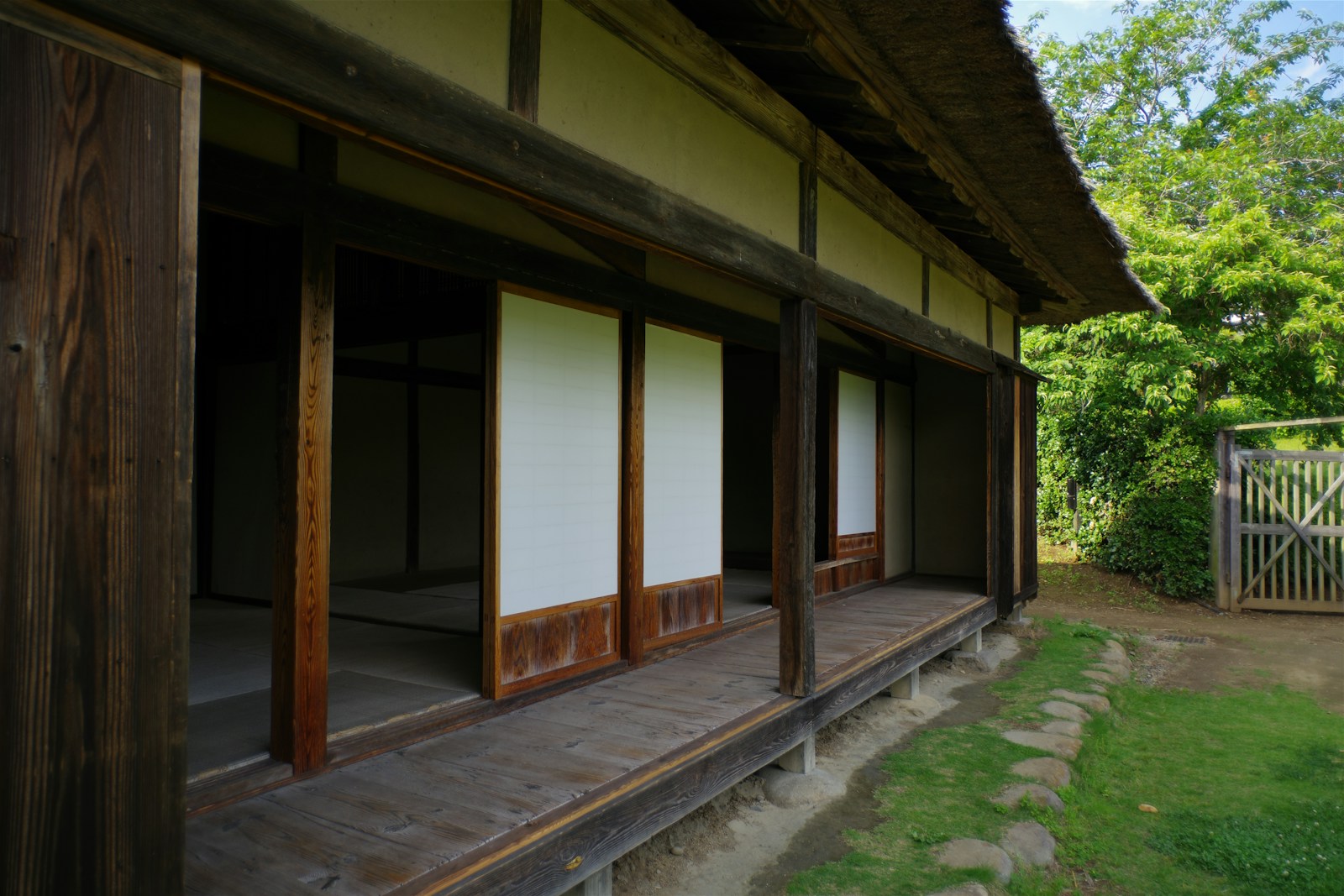 A house with a wooden porch and white walls