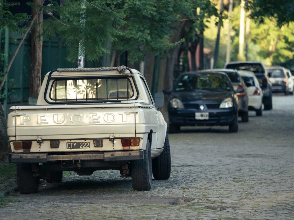 a white truck parked on the side of a road